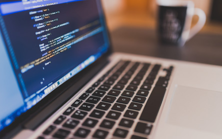Code displayed on a MacBook